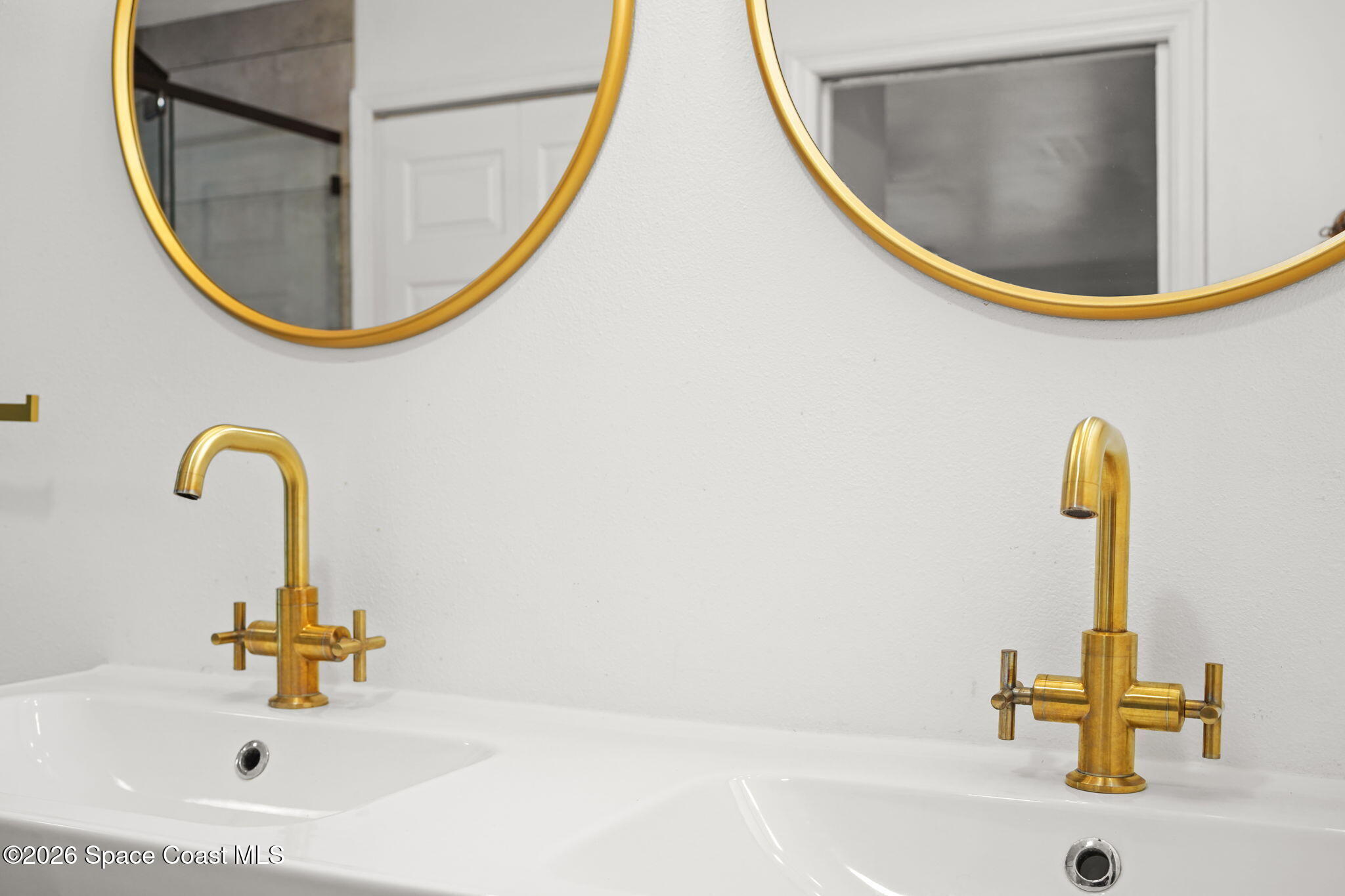 470 South Carpenter Road Titusville, FL 32796 - Photo 33 of 55 a bathroom with a sink and a mirror
