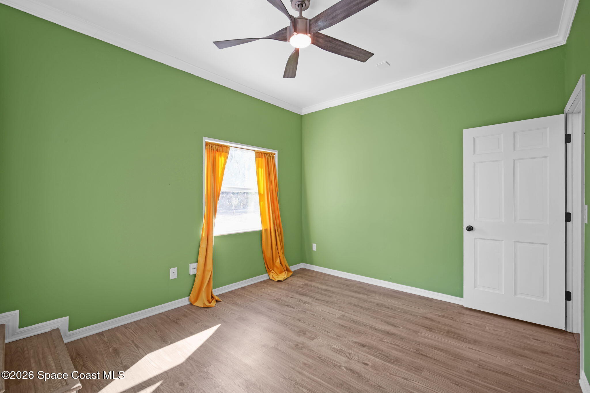 470 South Carpenter Road Titusville, FL 32796 - Photo 37 of 55 a view of room with window and ceiling fan