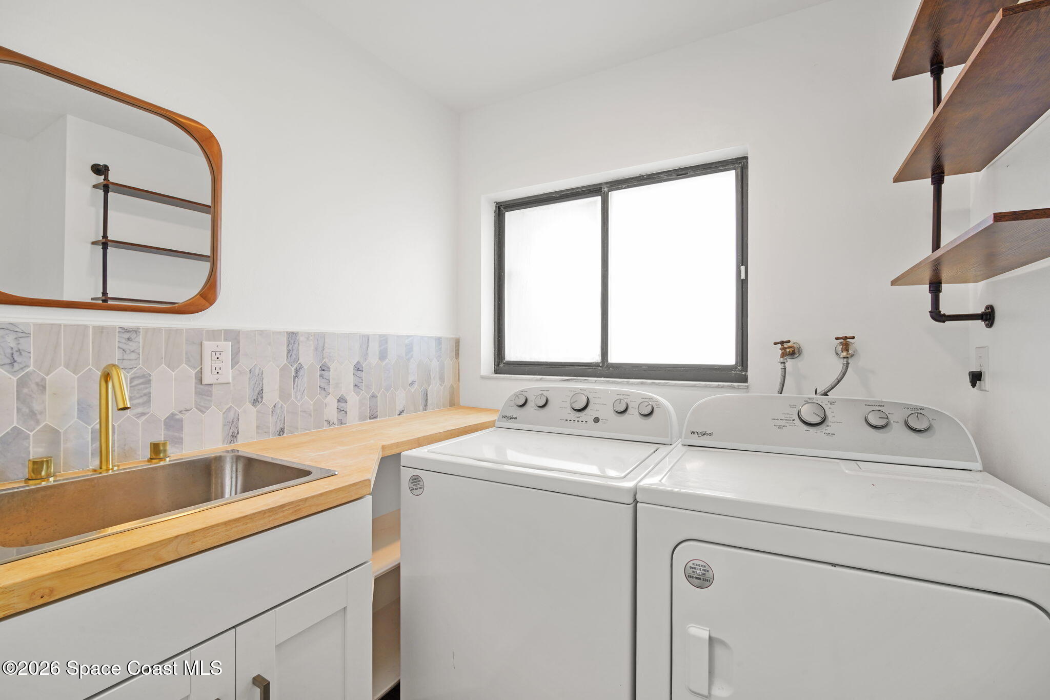 470 South Carpenter Road Titusville, FL 32796 - Photo 40 of 55 a utility room with dryer and washer