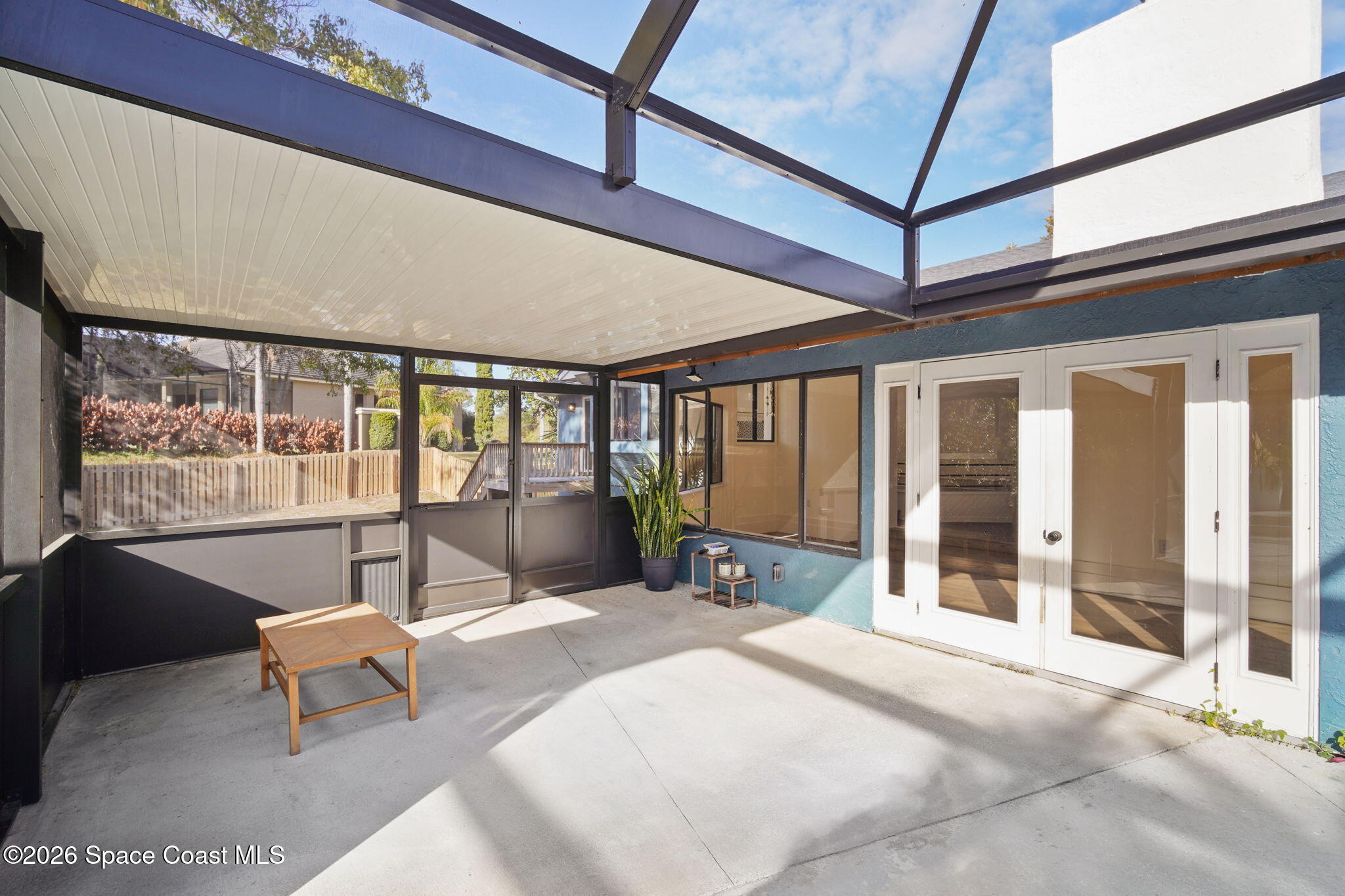 470 South Carpenter Road Titusville, FL 32796 - Photo 42 of 55 a bedroom with furniture and large windows