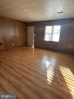 21628 Great Mills Road, Unit F2 Lexington Park, MD 20653 - Photo 3 of 5 an empty room with wooden floor and windows