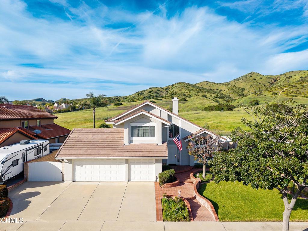 6051 Mescallero Place Simi Valley, CA 93063 - Photo 1 of 1 a front view of a house with a yard