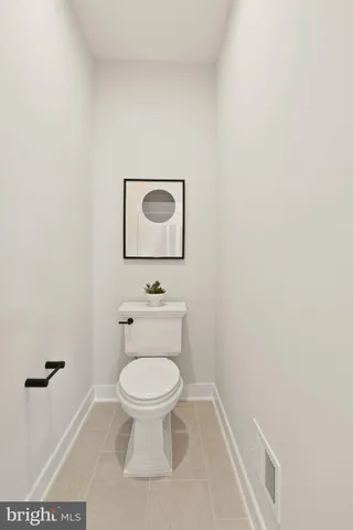 a view of a dining room with furniture and a table