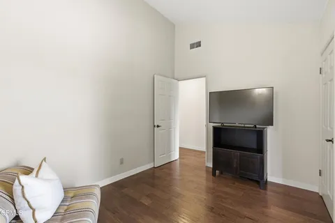 a living room with a flat screen tv and a couch
