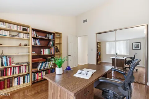 a view of a workspace with furniture and workspace