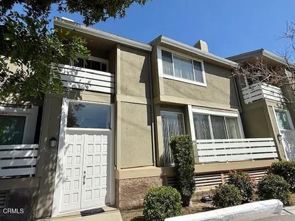a view of a house with a door and balcony