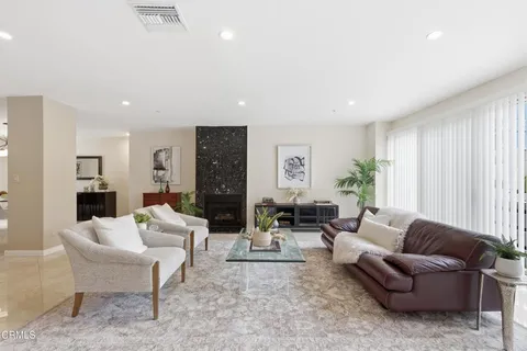 a living room with furniture and a large window