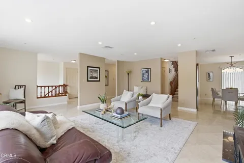a living room with furniture and a table