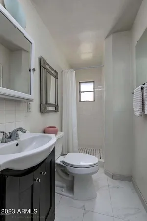 a bathroom with a sink and a toilet