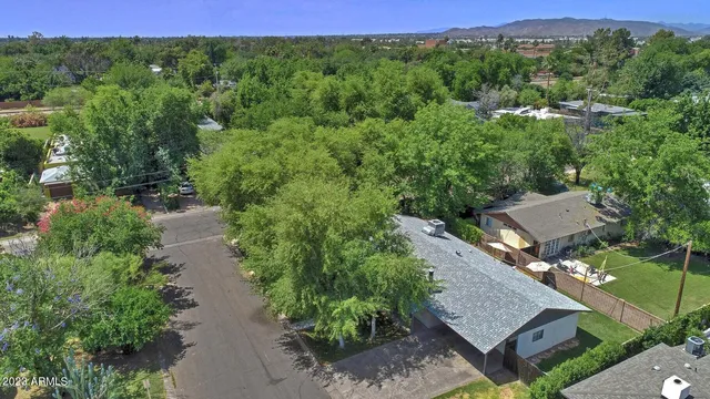 an aerial view of a house with mountain view