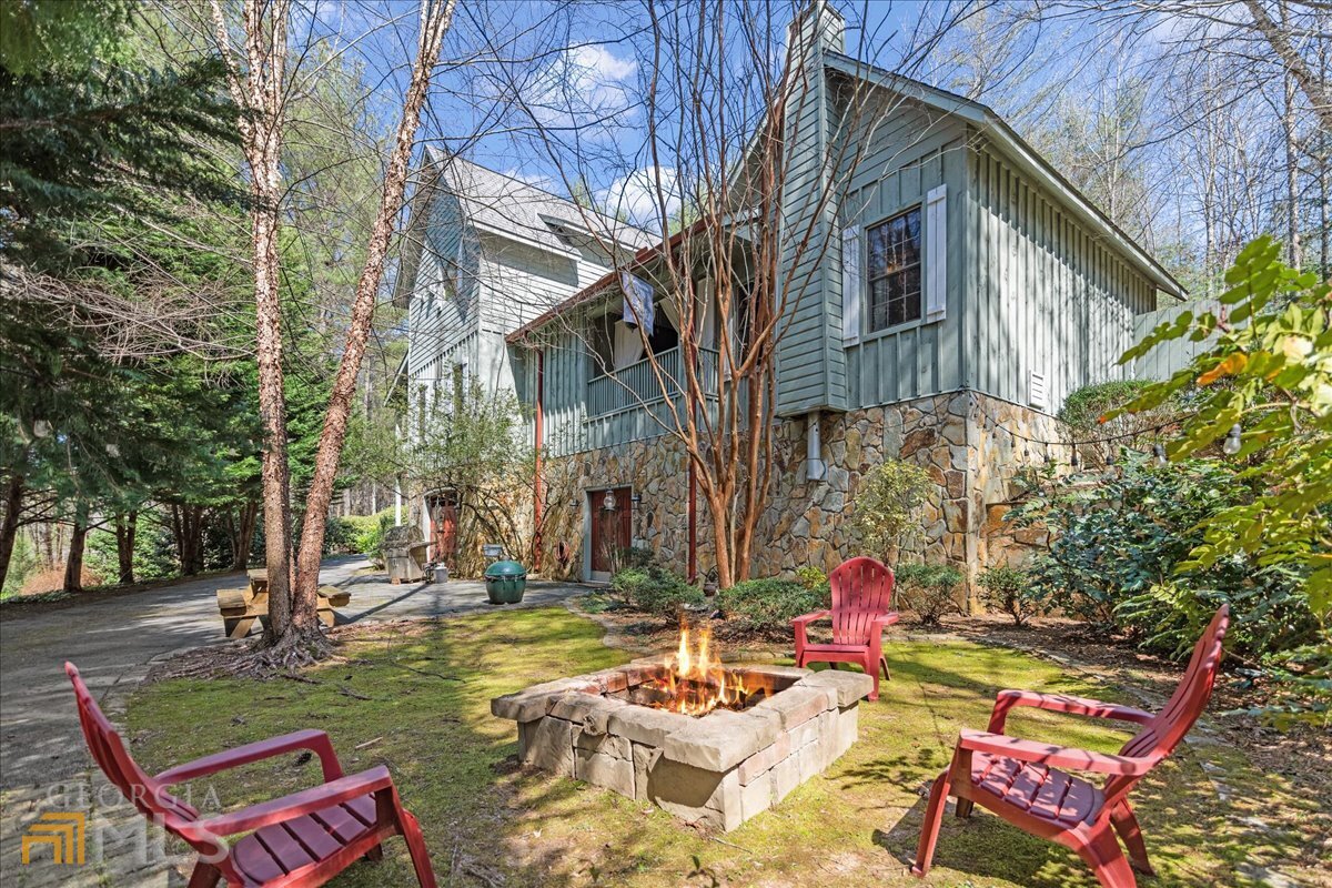 233 Twin Lakes Road, Unit 7 Blue Ridge, GA 30513 - Photo 1 of 1 a view of backyard with outdoor seating