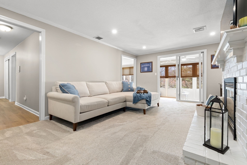 167 Village Post Road, Unit 167 Danvers, MA 01923 - Photo 12 of 42 a living room with furniture and a flat screen tv