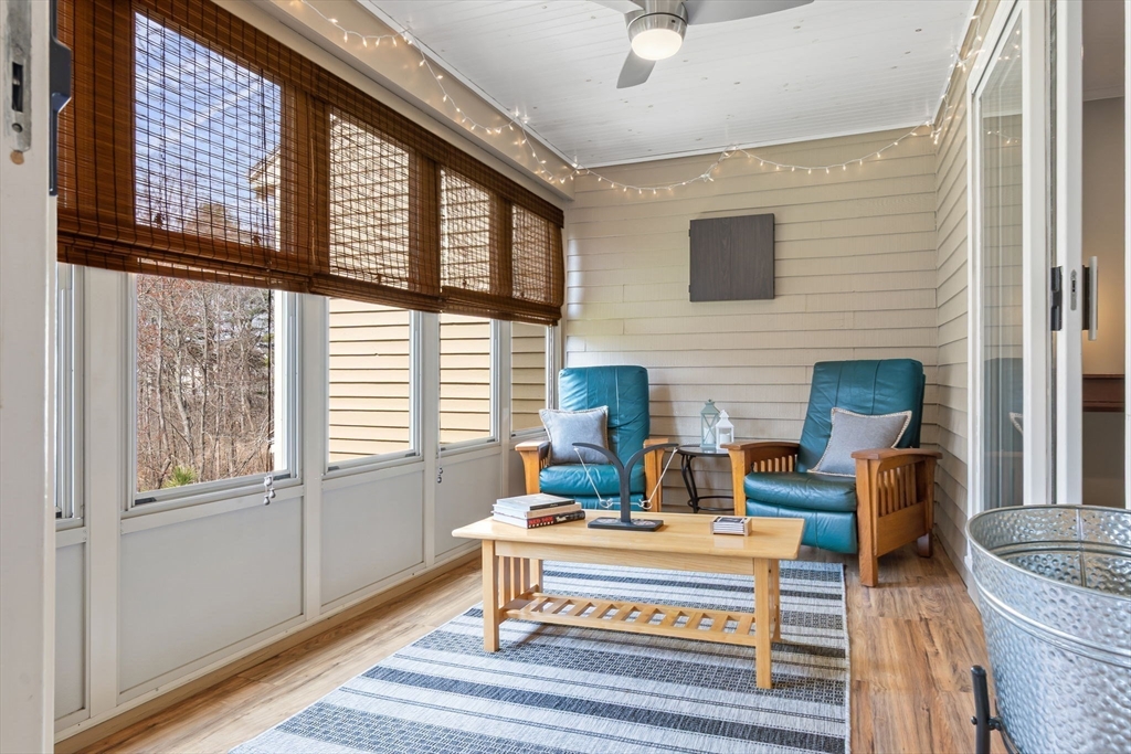 167 Village Post Road, Unit 167 Danvers, MA 01923 - Photo 14 of 42 a living room with furniture fireplace and a window