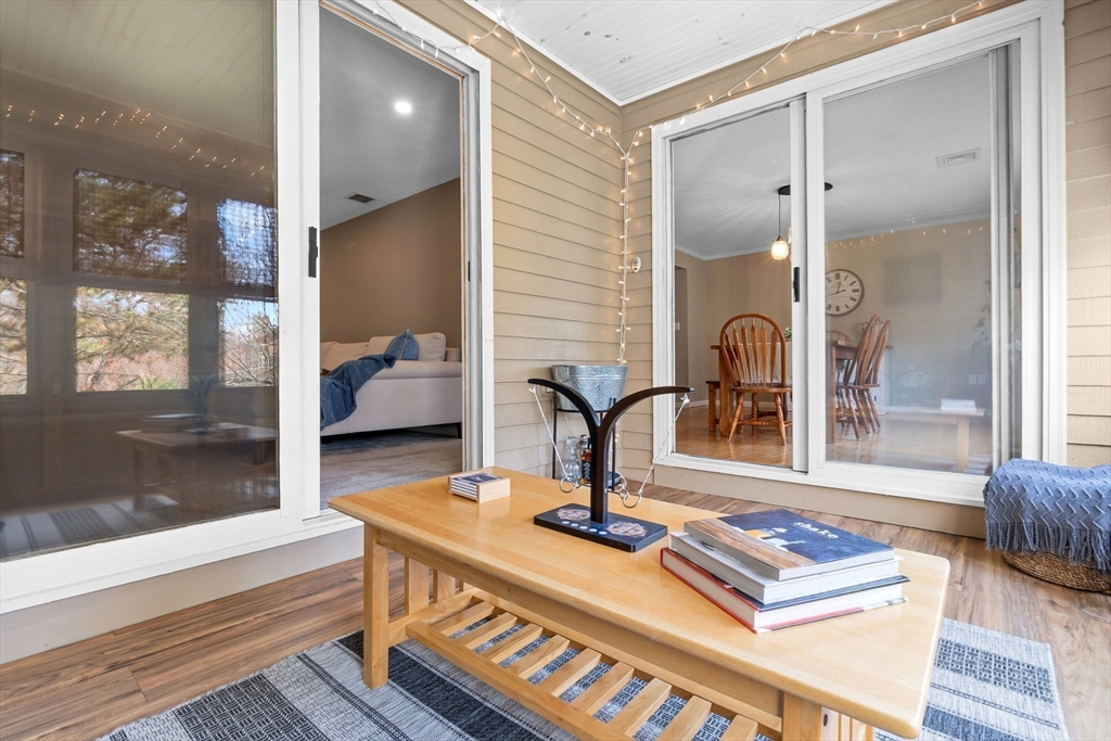167 Village Post Road, Unit 167 Danvers, MA 01923 - Photo 15 of 42 a view of a lobby area with a couch and glass door