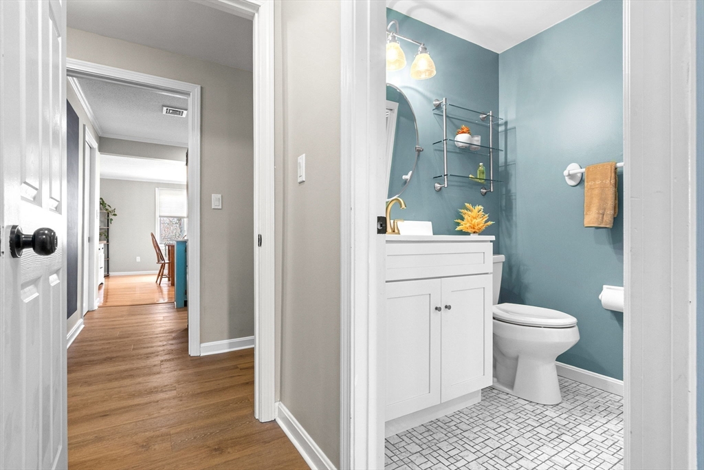 167 Village Post Road, Unit 167 Danvers, MA 01923 - Photo 21 of 42 a bathroom with a sink a toilet and shower