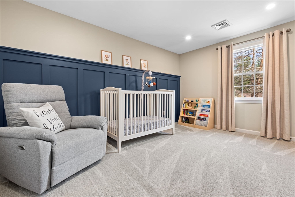 167 Village Post Road, Unit 167 Danvers, MA 01923 - Photo 26 of 42 a bedroom with furniture and white walls