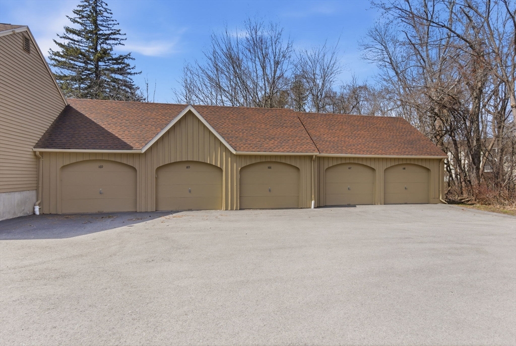 167 Village Post Road, Unit 167 Danvers, MA 01923 - Photo 36 of 42 a house with trees in the background