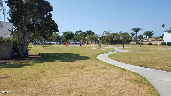 a view of a swimming pool and a yard