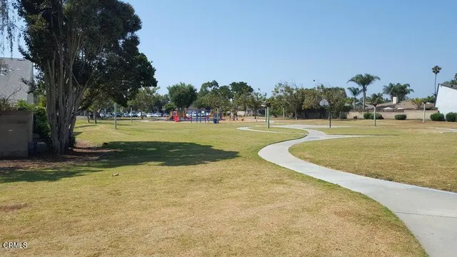 a view of a swimming pool and a yard