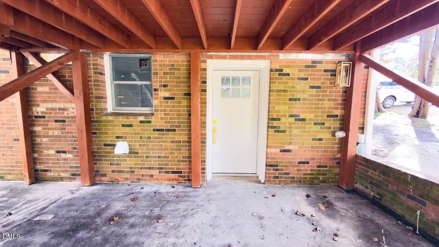 a view of an empty room with windows