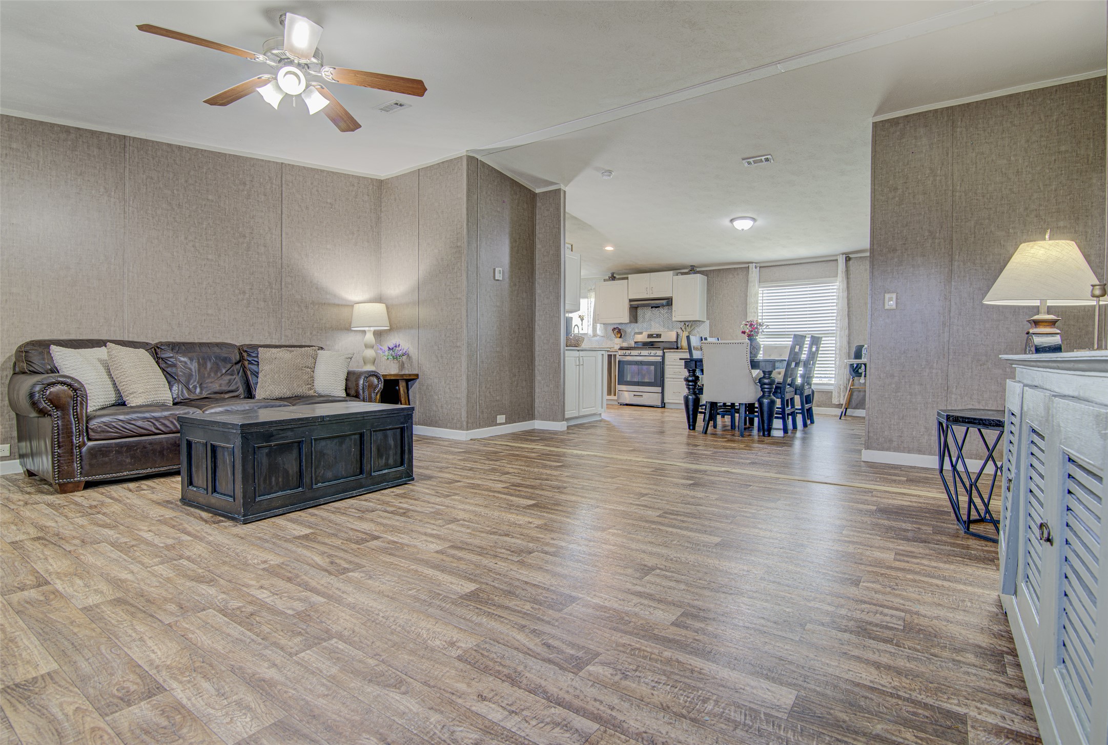 445 Rancho Linda Drive Lockhart, TX 78644 - Photo 26 of 26 An open floor plan seamlessly connects the living room, dining area, and kitchen, creating a harmonious flow.