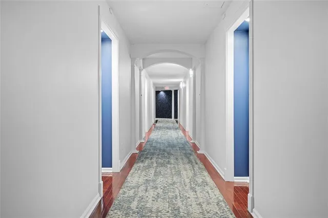 a view of a hallway with a white walls