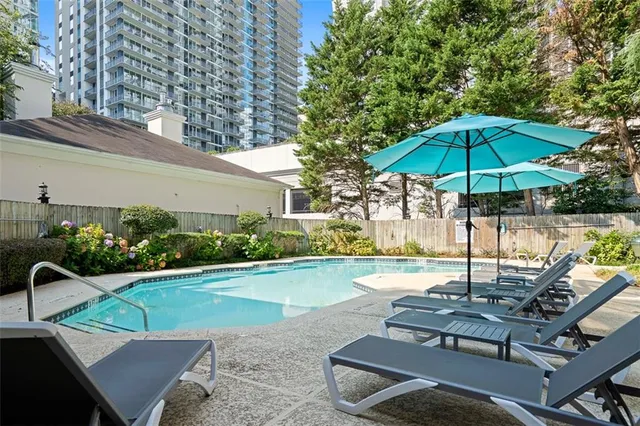 a view of a chairs and table in the patio