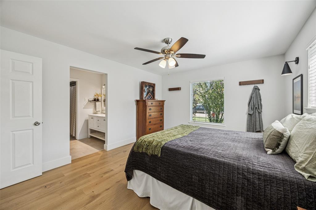 3412 Old Colony Road Dallas, TX 75233 - Photo 16 of 30 a bedroom with a bed and a ceiling fan