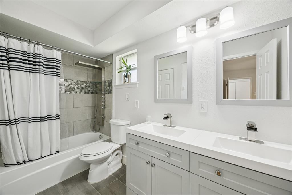 3412 Old Colony Road Dallas, TX 75233 - Photo 22 of 30 a bathroom with a sink a toilet and shower