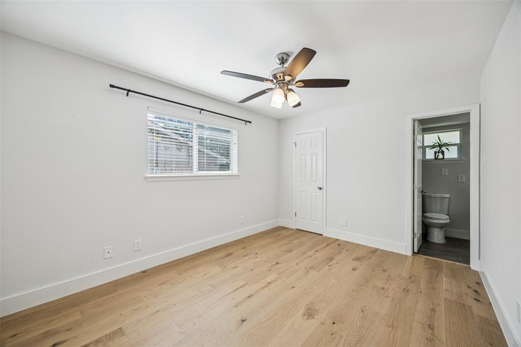3412 Old Colony Road Dallas, TX 75233 - Photo 24 of 30 a view of empty room with wooden floor and fan