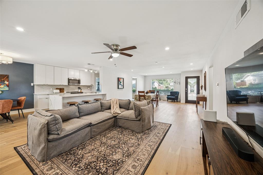 3412 Old Colony Road Dallas, TX 75233 - Photo 4 of 30 a living room with furniture and view of kitchen