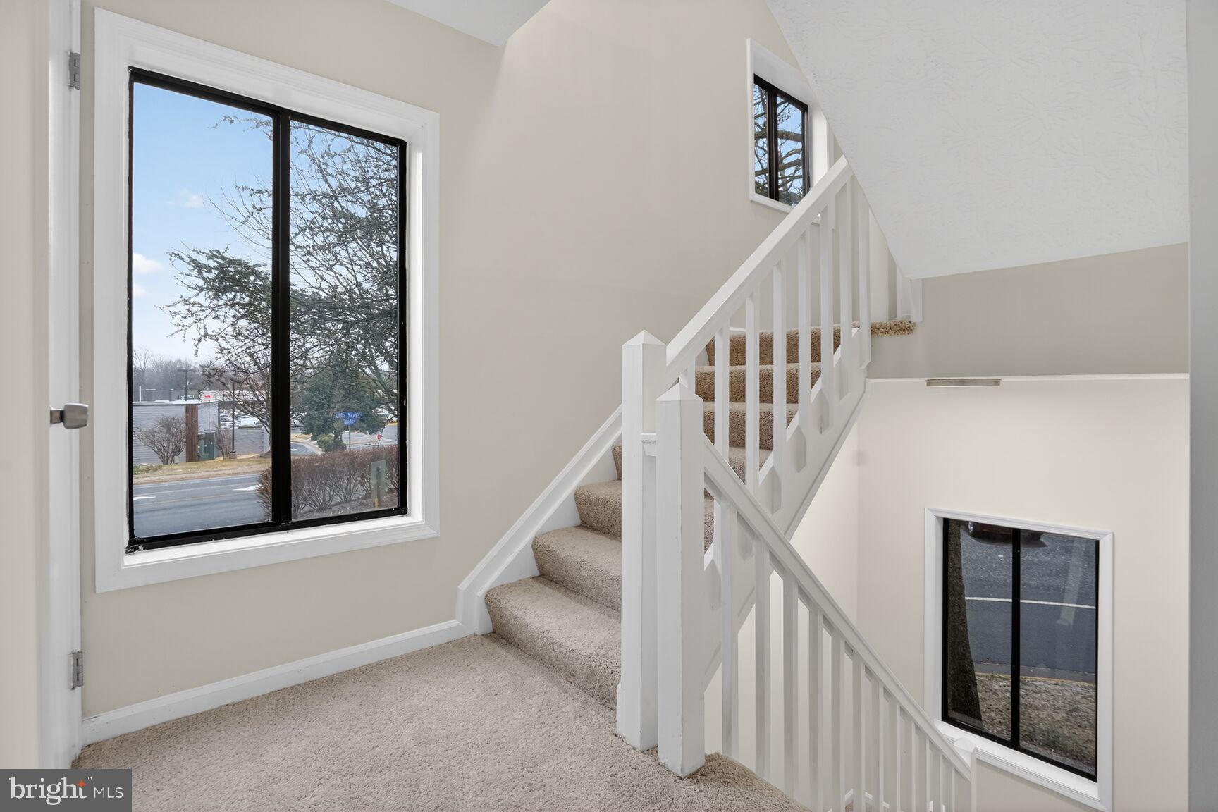 2273 Hunter's Run Drive Reston, VA 20191 - Photo 15 of 23 a view of staircase with lots of windows and flower pot