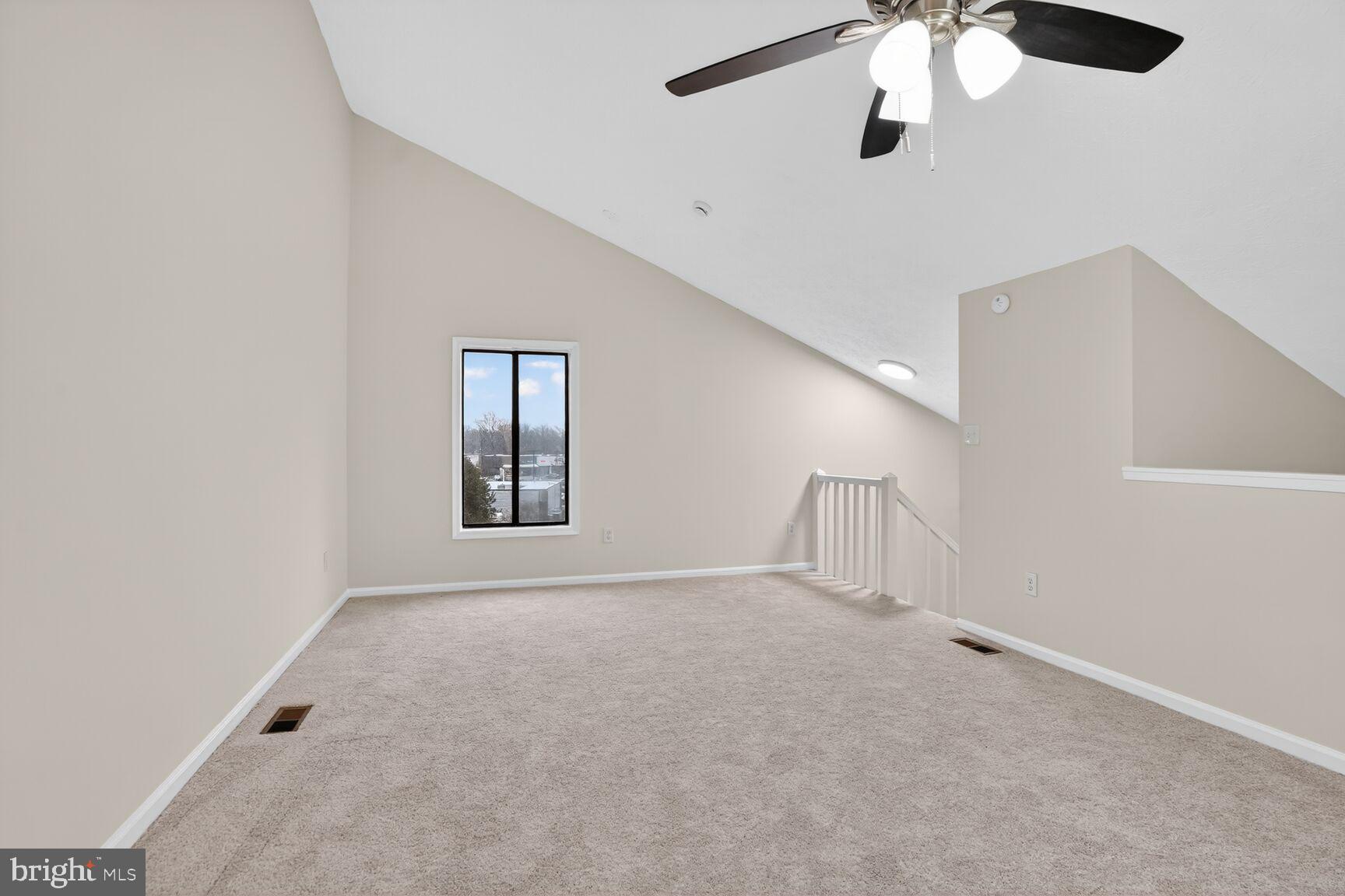2273 Hunter's Run Drive Reston, VA 20191 - Photo 17 of 23 en empty room with windows and chandelier fan