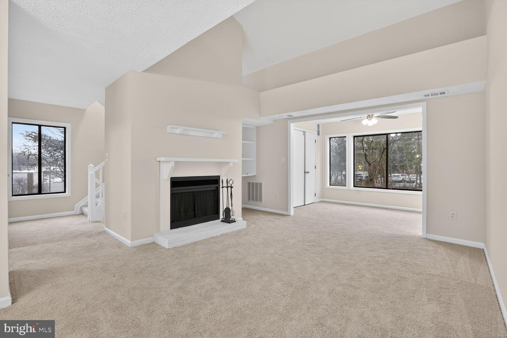 2273 Hunter's Run Drive Reston, VA 20191 - Photo 6 of 23 an empty room with windows and fireplace