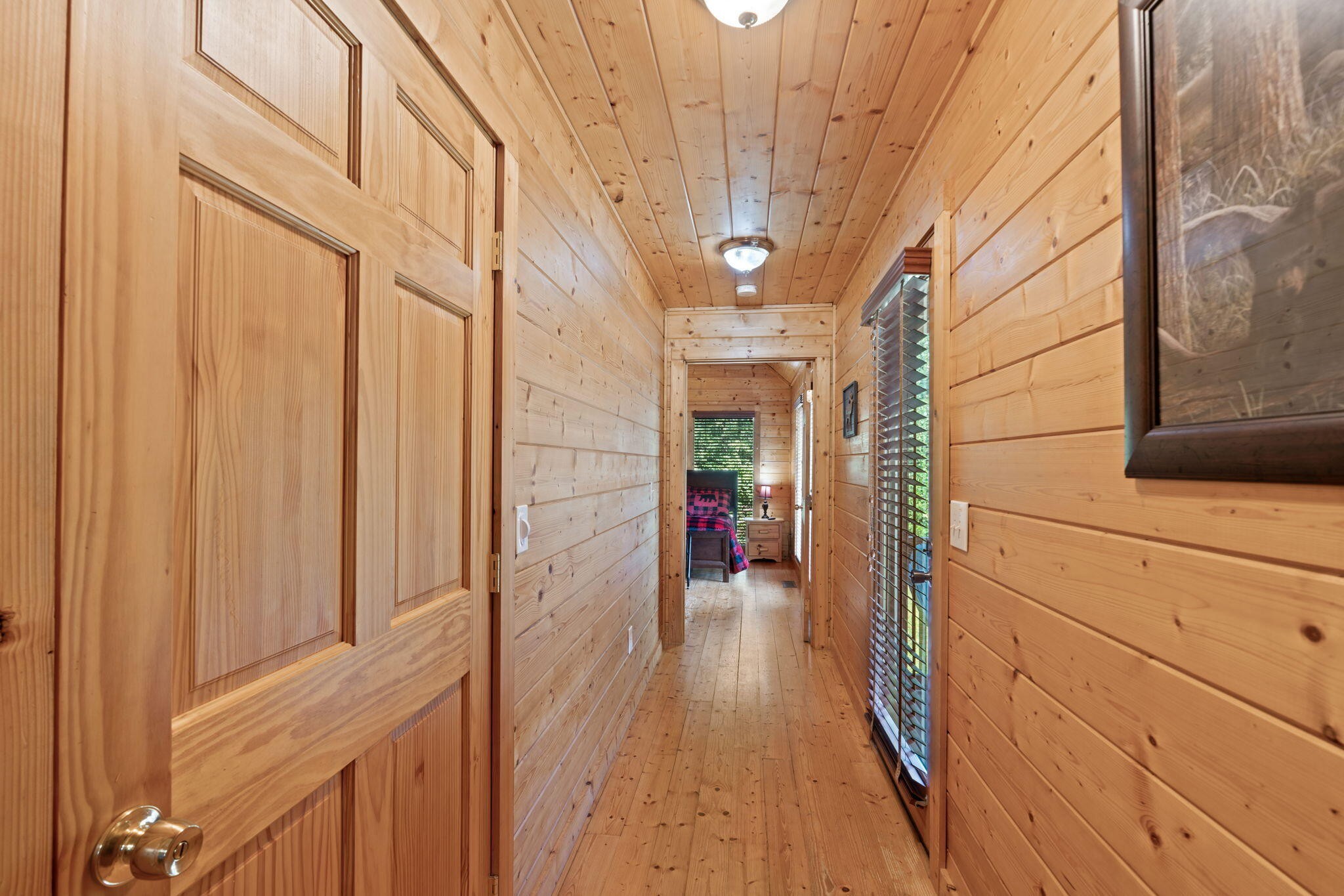 947 Belltown Road Copperhill, TN 37317 - Photo 16 of 26 a view of a hallway with wooden floor and staircase