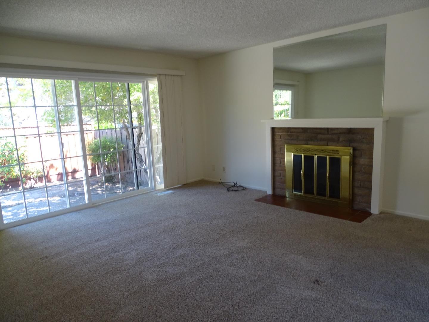 3345 Glendora Drive San Mateo, CA 94403 - Photo 12 of 19 a view of an empty room with a fireplace