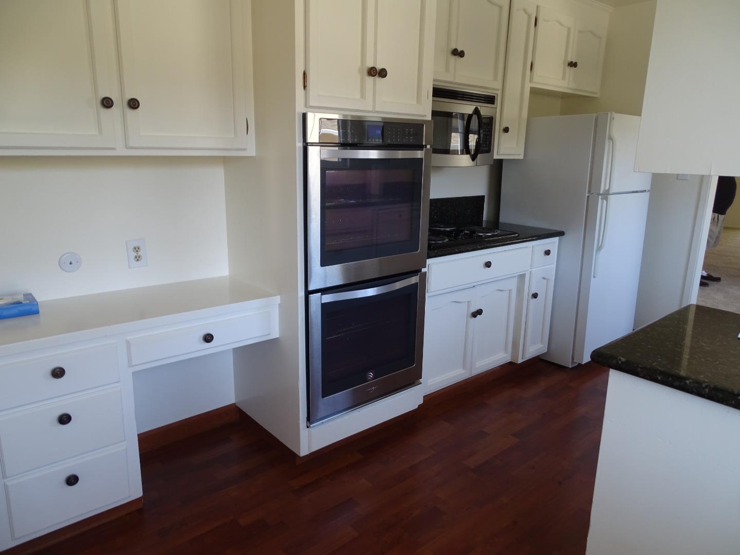 3345 Glendora Drive San Mateo, CA 94403 - Photo 2 of 19 a kitchen with stainless steel appliances a refrigerator stove and cabinets