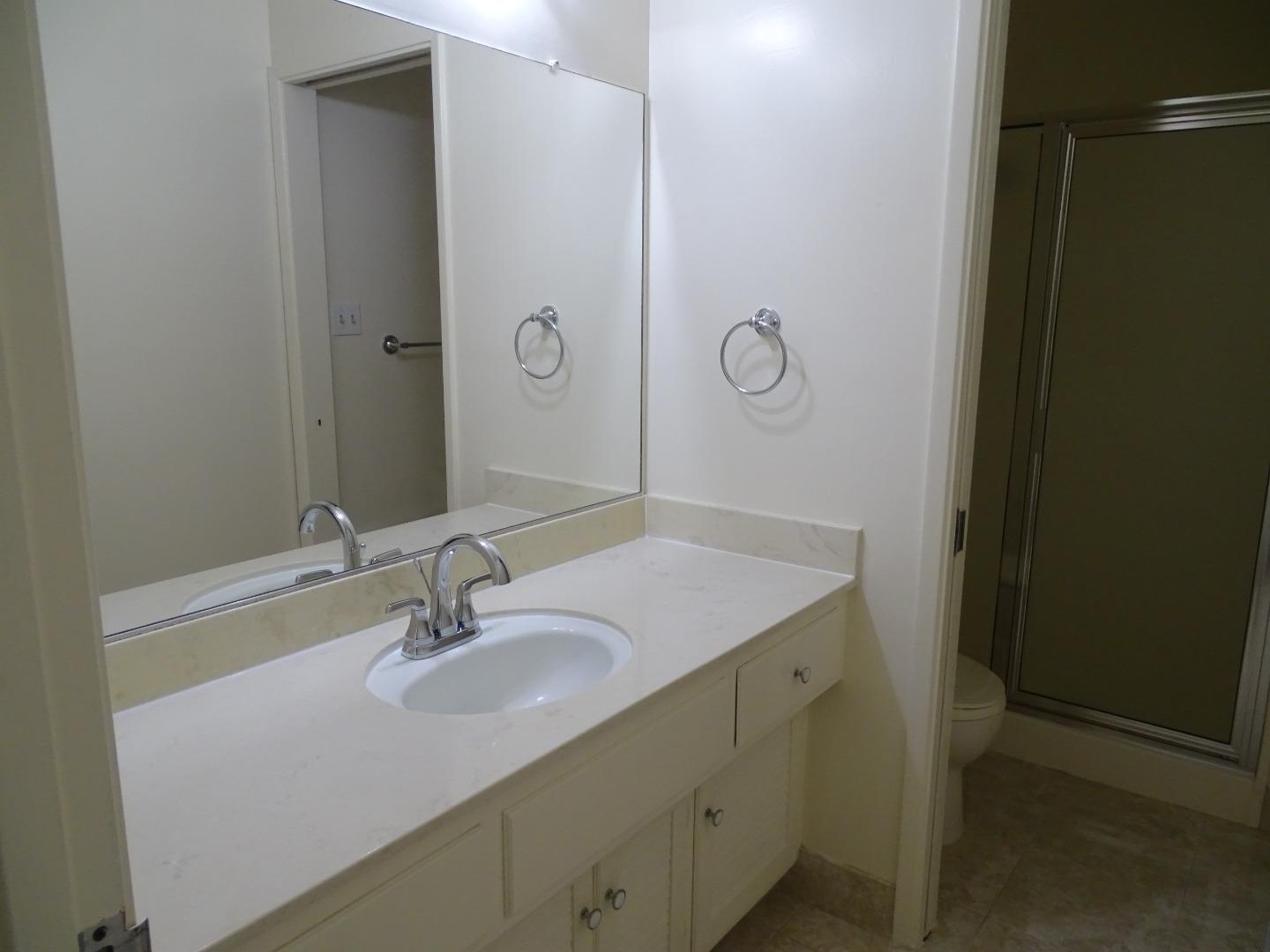 3345 Glendora Drive San Mateo, CA 94403 - Photo 5 of 19 a bathroom with a sink and a mirror