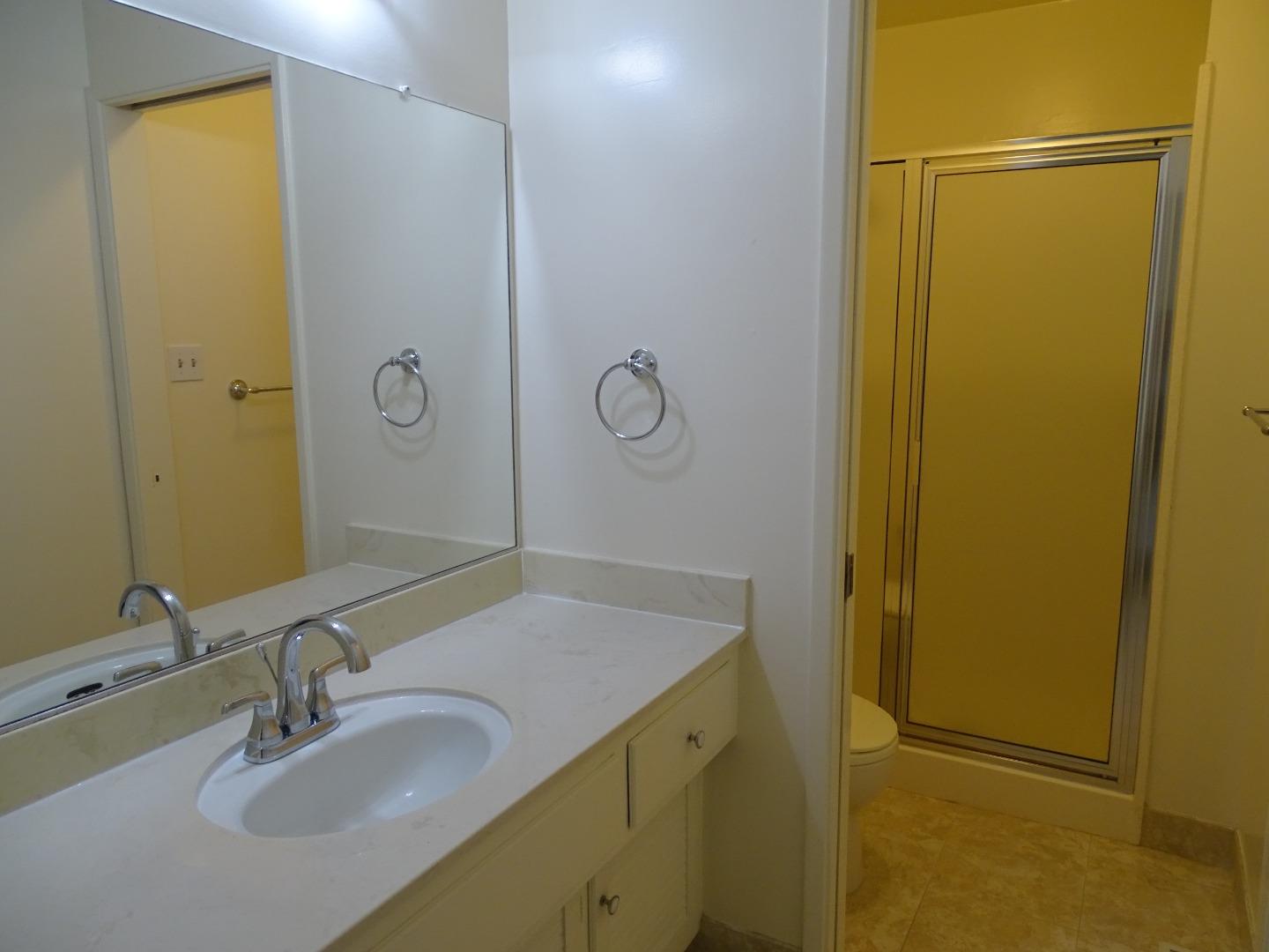 3345 Glendora Drive San Mateo, CA 94403 - Photo 6 of 19 a bathroom with a sink and a mirror