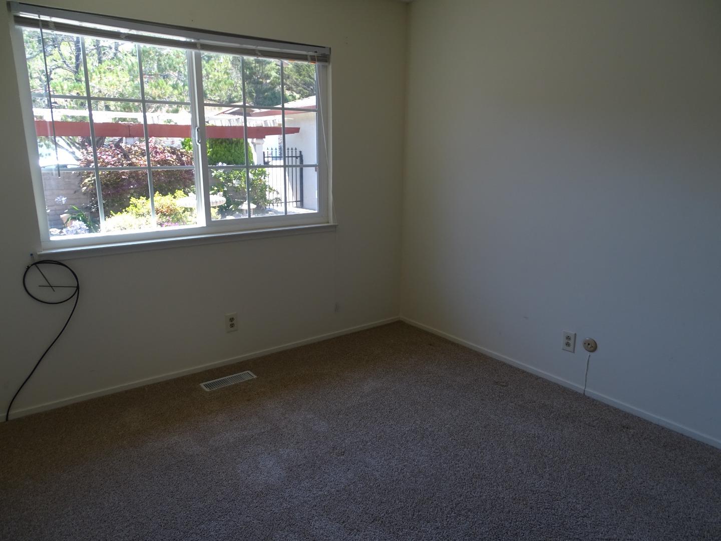 3345 Glendora Drive San Mateo, CA 94403 - Photo 7 of 19 an empty room with a window