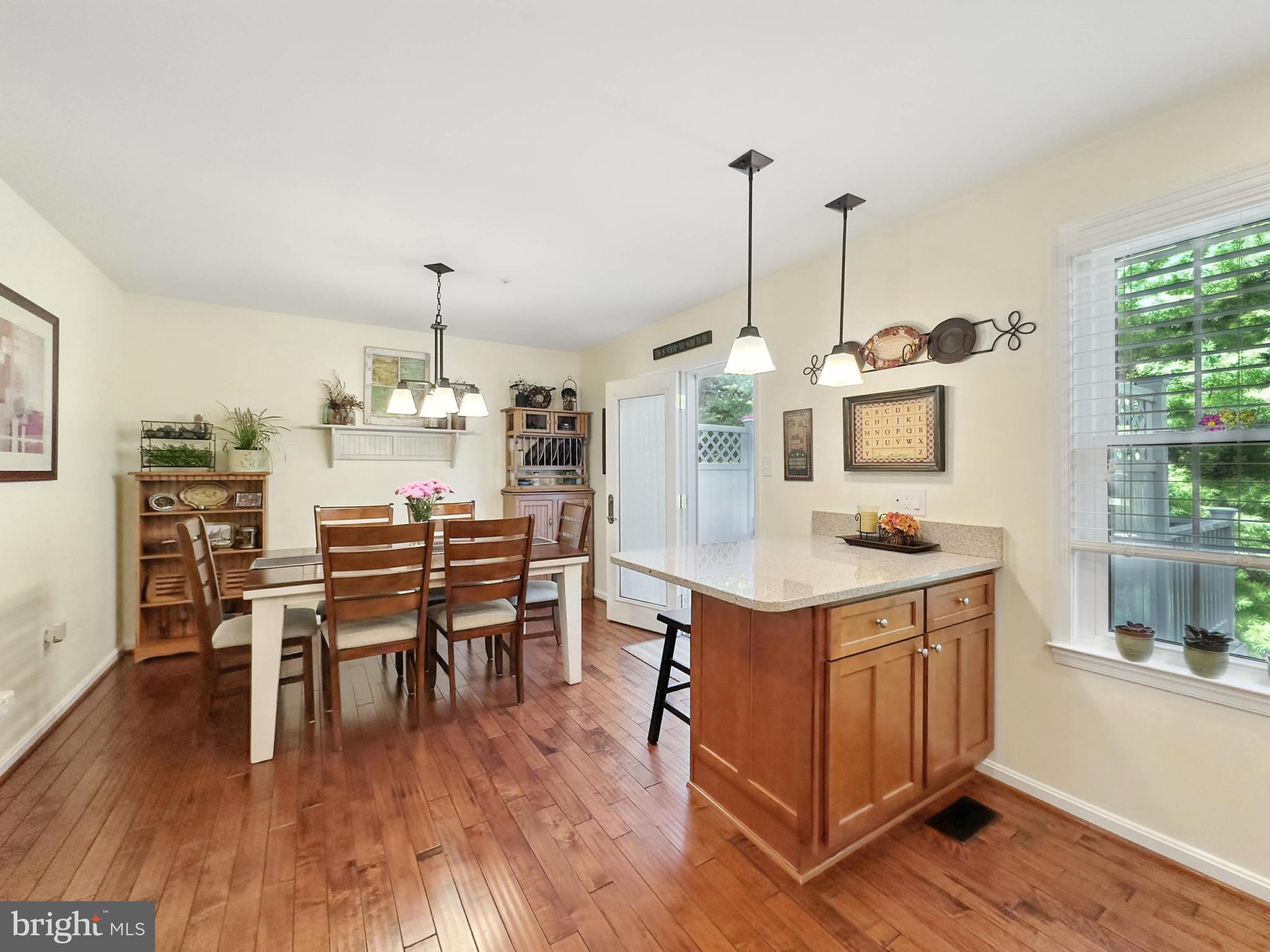 25744 Woodfield Road Damascus, MD 20872 - Photo 13 of 43 Bright and inviting kitchen with warm wood tones.