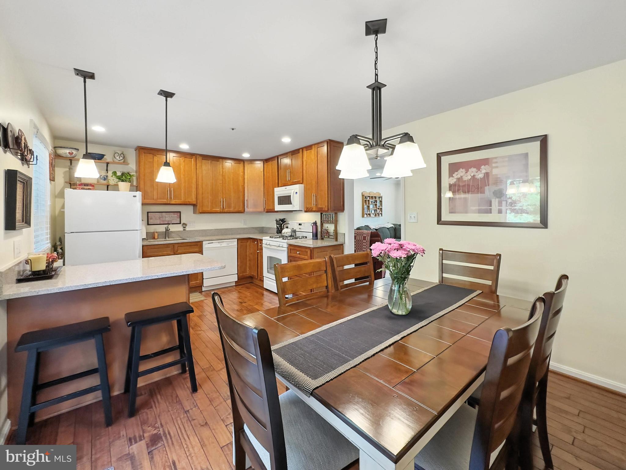25744 Woodfield Road Damascus, MD 20872 - Photo 14 of 43 Inviting kitchen with warm wood accents.