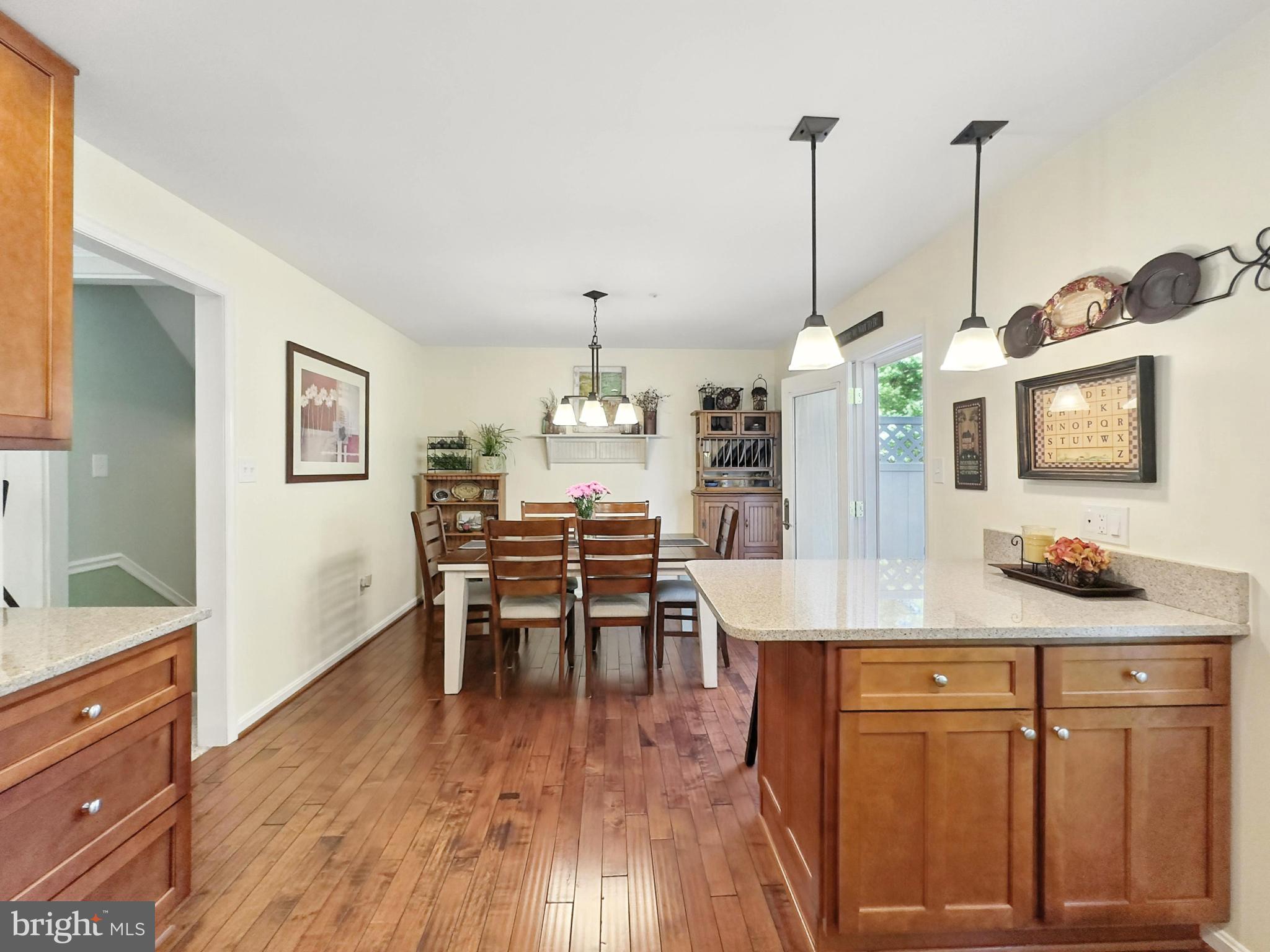 25744 Woodfield Road Damascus, MD 20872 - Photo 18 of 43 Inviting kitchen with warm wood accents.