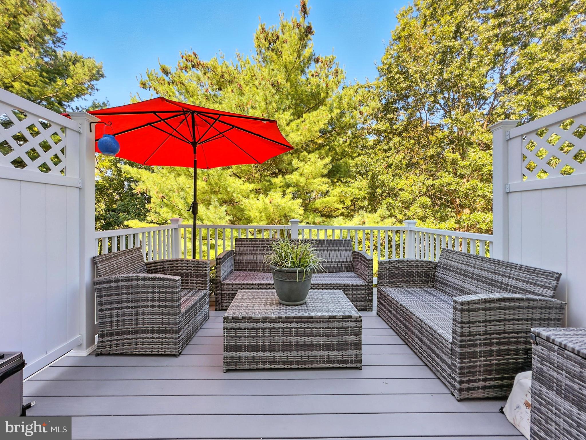25744 Woodfield Road Damascus, MD 20872 - Photo 20 of 43 Charming deck oasis with vibrant umbrella.