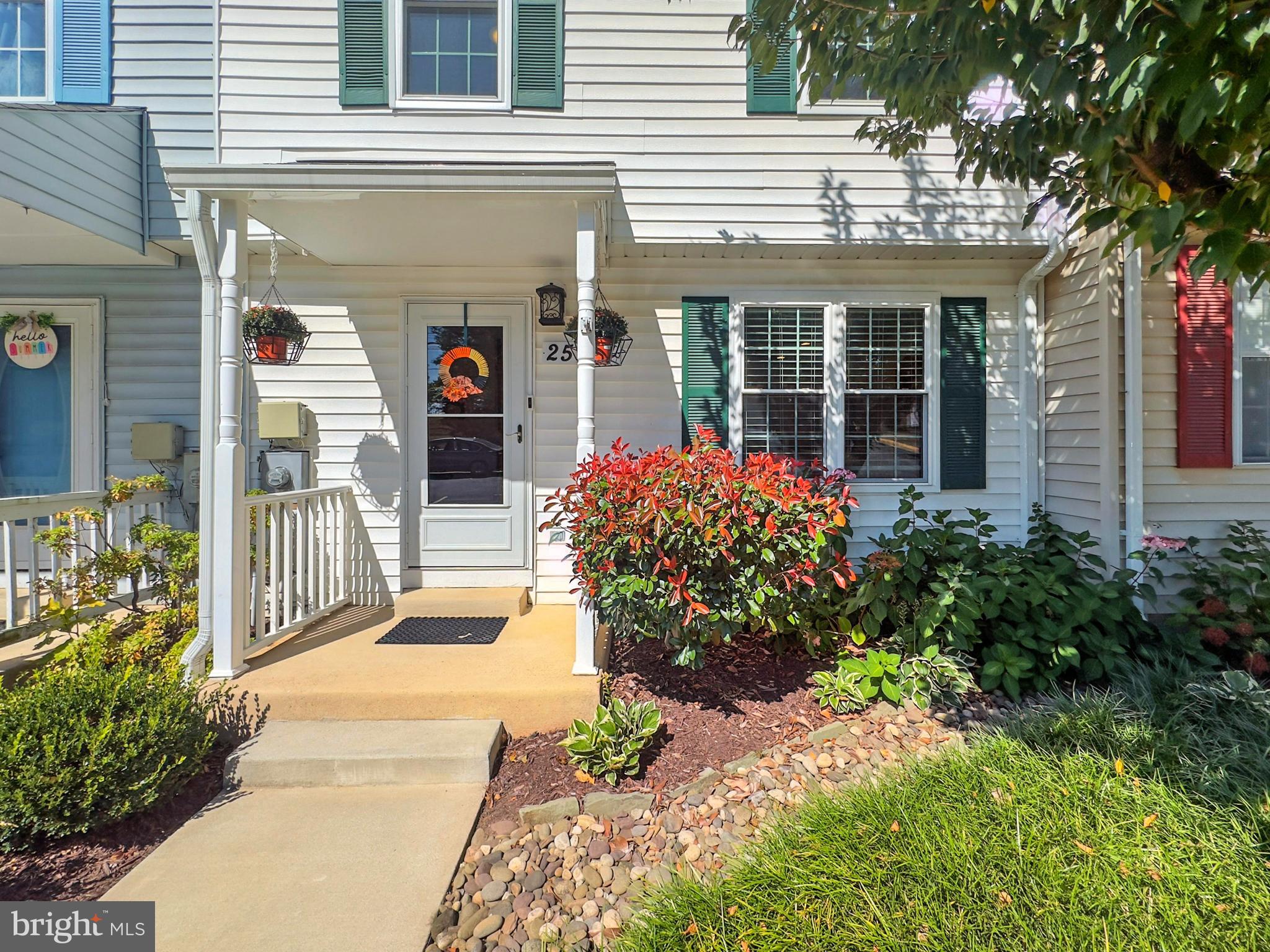 25744 Woodfield Road Damascus, MD 20872 - Photo 2 of 43 Charming entryway with vibrant landscaping.