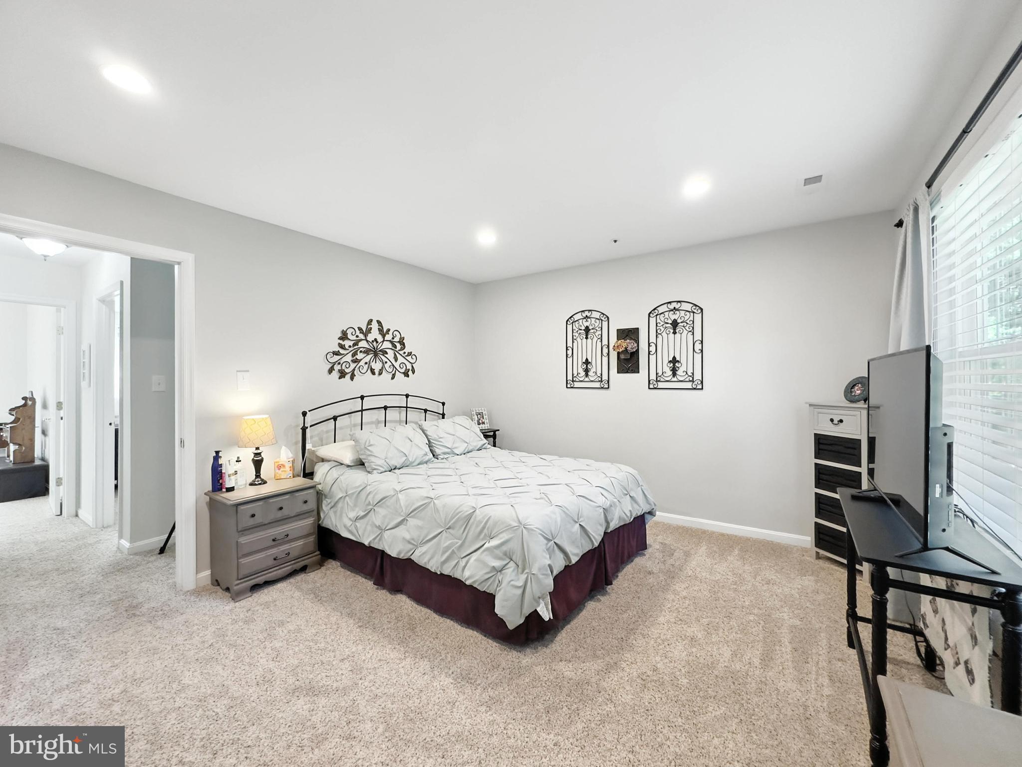 25744 Woodfield Road Damascus, MD 20872 - Photo 22 of 43 Serene bedroom with modern elegance.