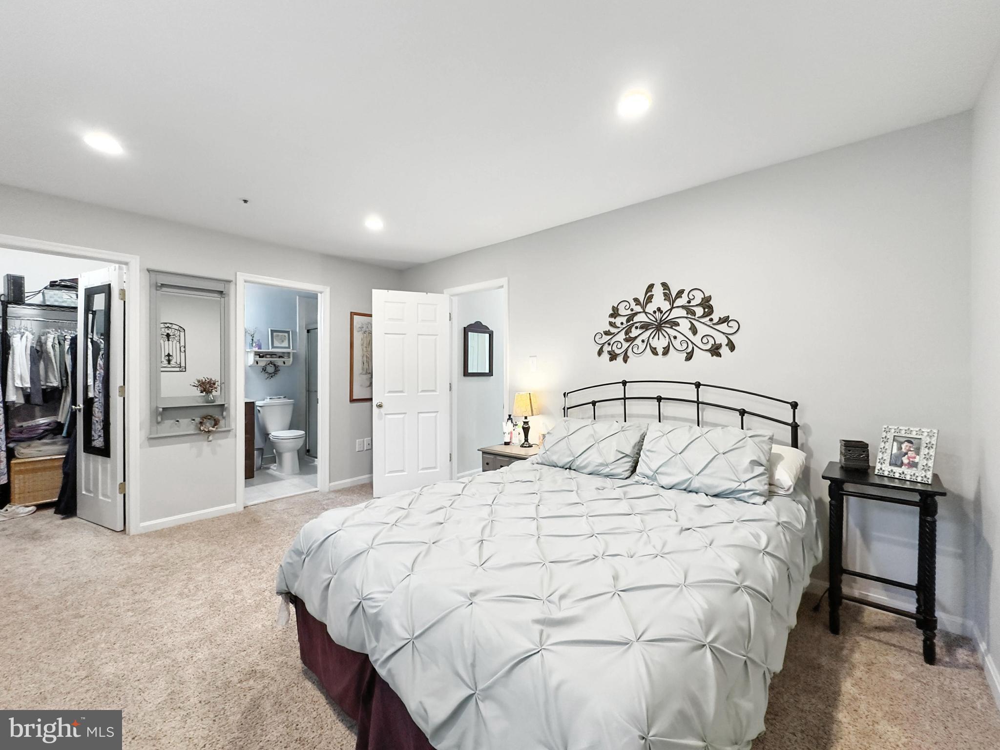 25744 Woodfield Road Damascus, MD 20872 - Photo 23 of 43 Serene bedroom with modern elegance.