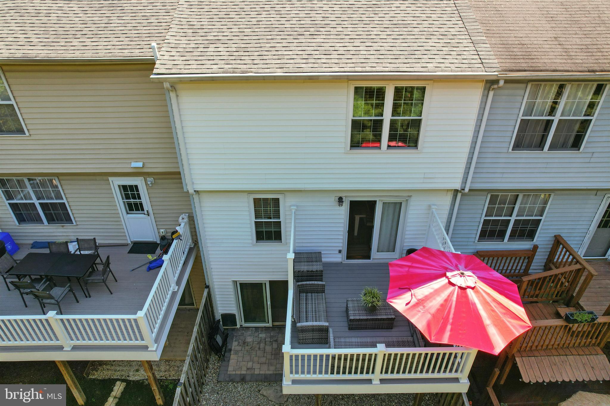 25744 Woodfield Road Damascus, MD 20872 - Photo 41 of 43 Charming backyard retreat with vibrant umbrella.
