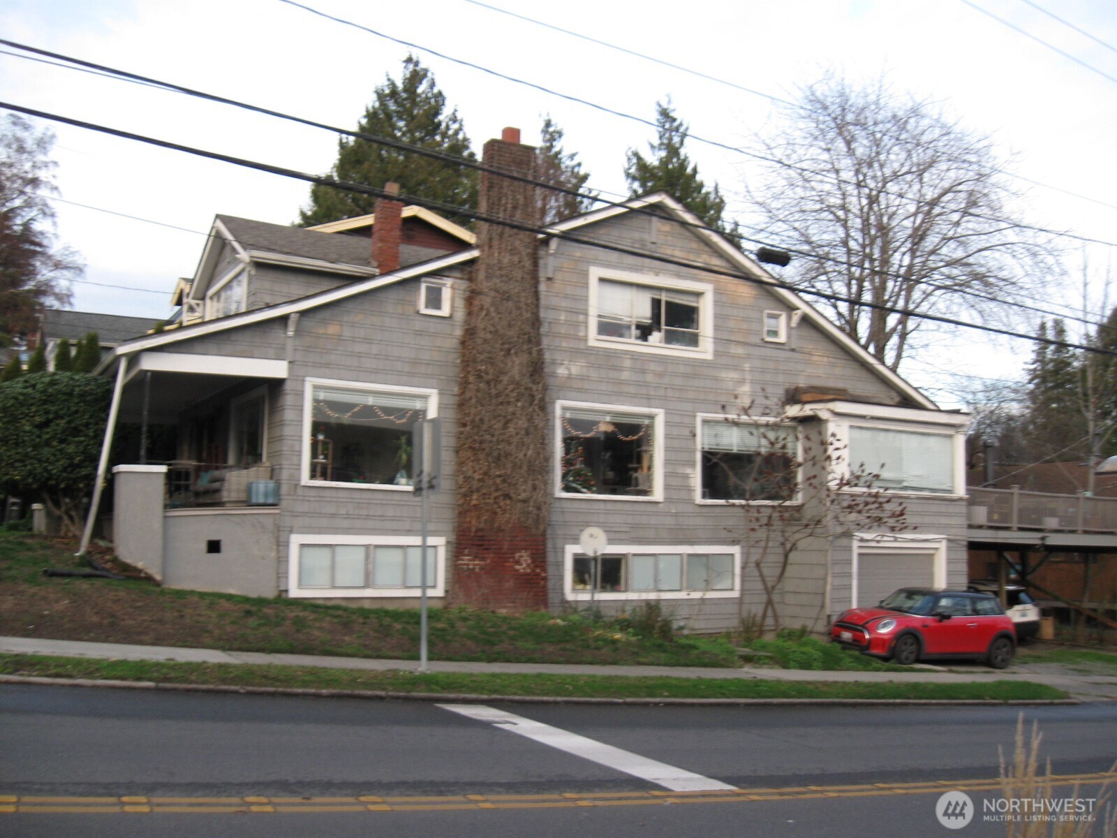 4002 2nd Avenue Northeast Seattle, WA 98105 - Photo 2 of 16 a front view of a house with a yard