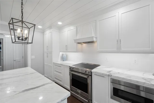 a kitchen with a stove and a refrigerator
